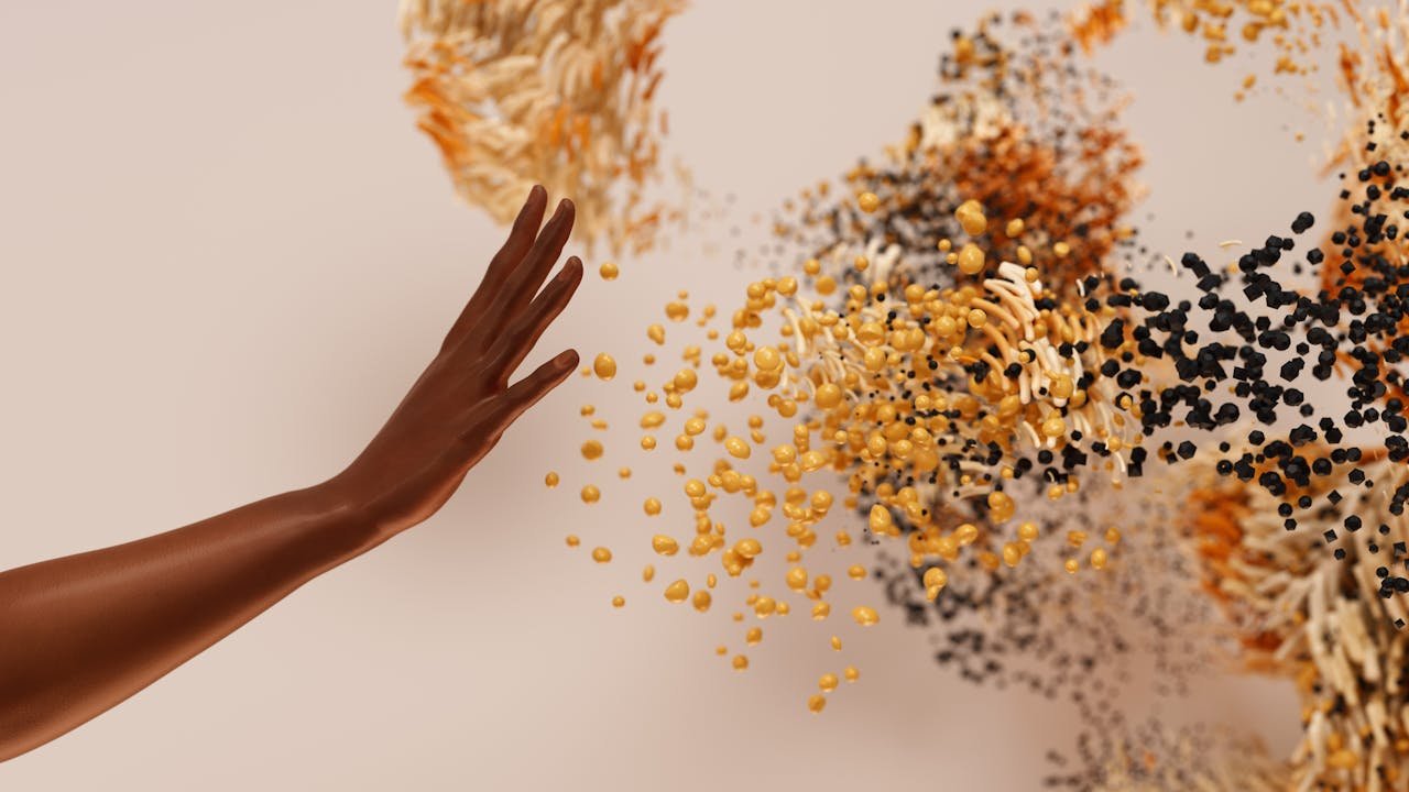 about-us Creative concept depicting a hand reaching towards abstract swirling particles.